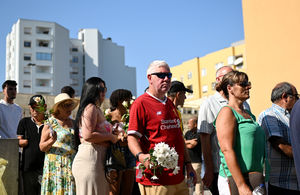A mourners wearing a Liverpool FC shirt pays their respects at the wake of Diogo Jota being held at Sao Cosme Chapel in the town of Gondomar near Porto