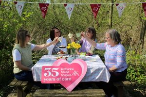 The fundraising team from Katharine House Hospice enjoying a tea party in the memorial gardens.