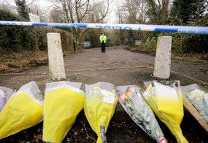 Flowers lay at the scene of Scribers Lane, near to where the 12-year-old was found with fatal stab wounds