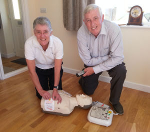 Picture shows Effie Cadwallader and Mike Lade with some of a training defibrillator