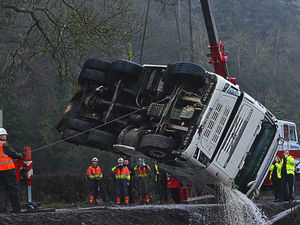 Supporting image for story: Canal plunge lorry recovery - in pictures