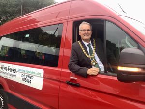Cllr Louis Stephen at the wheel of a WFCT minibus