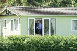 Police searching a static caravan at the scene. Photo: SnapperSK