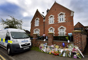 Flowers outside the family home and scene of the stabbings on Greyhound Lane