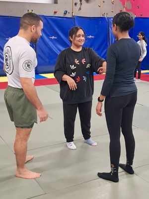 Reel Grappling founder Kelvin (left) supports Nabkiran (centre)