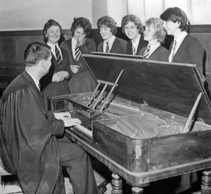 March 1962: The caption reads: 'Mr J. Buckley is an accomplished pianist playing both classical and jazz music. Pupils of one of his classes at Rugeley Grammar School where he is music master certainly think so. It isn't often he has the opportunity of playing on an instrument like the one pictured above. It is a square piano built by John Broadwood and Sons Ltd, of London, about the year 1*90 (middle bit missing, probably 1890). One of the few instruments of its kind in the country, the old piano was found lying on its side in a damp garage. It is on loan to the school for the school's production of Beggar's Operat to be held during the last week of March.'
