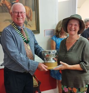 Peter Dunhill Club President presenting the Meole Brace Cup to Sarah Adams for the most points in the vegetable section