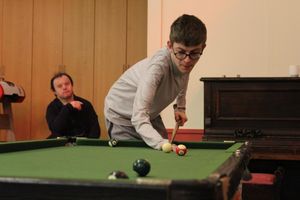A youngster playing pool at the Gateway Club