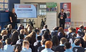 (L-R) Ami and Safwan from Embark Learning talk to the children from Queensbridge School in Birmingham.