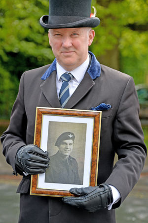 John Cumiskey from Wombourne funeral services with a photo of Victor Clarke