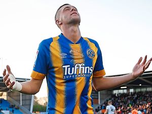 Supporting image for story: Shrewsbury Town fans looking forward in window