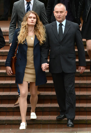 Peter Wilkinson leaves Birmingham Crown Court with his daughter Lydia, after Barley pleaded guilty to the murders of his wife and son