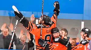 Andy Mckinney and Adam Taylor Celebrate with Doug Clarkson and the Tigers Fans.