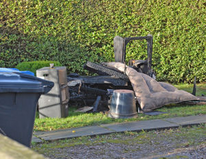 Burnt and ruined furniture was seen outside the house