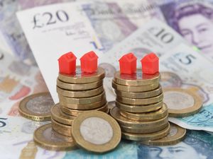Models of homes on coins