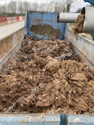 A close-up of the skip filled with items that shouldn’t be flushed