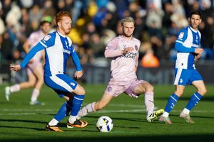 Taylor Perry of Shrewsbury Town and Ryan Woods of Oldham Athletic