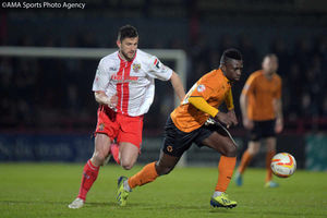  Nouha Dicko of Wolverhampton Wanderers and John Moushino of Stevenage.