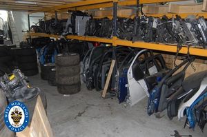 Stripped down parts inside one of the chop shops