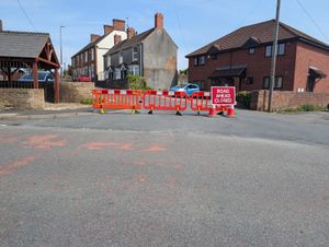 The road remains closed