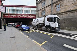The bus stop sits across the lane of traffic on Castle Gates.