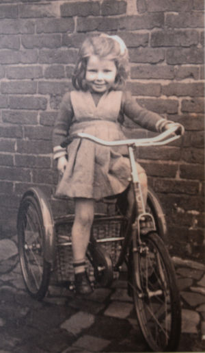 Sandra Hughes on her bike aged 5, in 1954