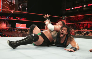 Samoa Joe locks in a hold on Roman Reigns on the Monday Night Raw television broadcast. Picture: WWE