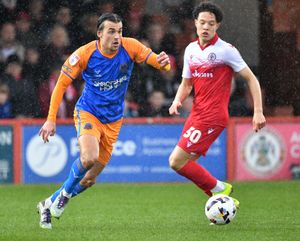 Shrewsbury Town’s Tom Sang and Accrington Stanley’s Isaac Heath. Picture: Tim Thursfield 