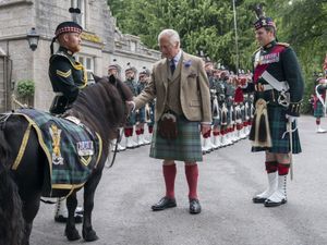 Supporting image for story: King pats Shetland pony mascot as a guard of honour marks his Balmoral arrival