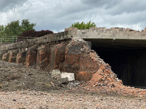 The bridge being ripped down