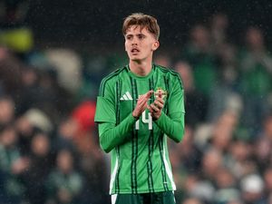 Isaac Price applauds the Northern Ireland fans