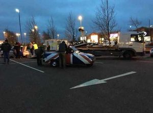 The team get to work fixing the Robin in the KFC car park. Photo: Jason Caddick