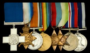 Chief Petty Officer Reginald Vincent Ellingworth and his George Cross (far left) and his other medals including a 1914-15 Star, British War and Victory Medals, a 1939-45 Star, Atlantic Star, War Medal 1939-45, and a Royal Navy Long Service & Good Conduct medal.