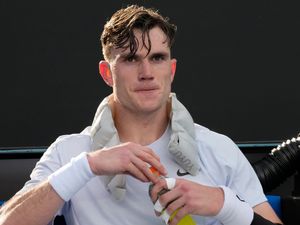 Jack Draper sits with an ice pack during his five-set match against Mariano Navone