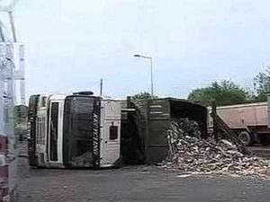Supporting image for story: Bulletin: Lorry topples over on island