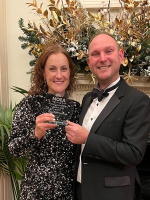 Beth and Sid Heath with the award