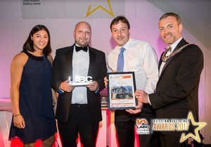 Mike Owen collecting the award