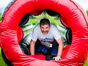 Supporting image for story: Runners take on inflatable obstacle course at Wolverhampton Racecourse - with pictures and video