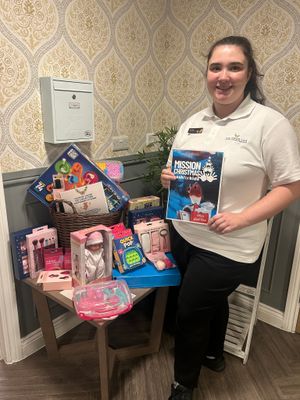 Colleague at HC-One’s Priorslee House Care Home with collection of donations