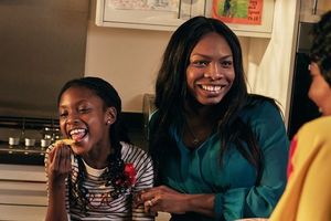 Mother and daughter eating chips