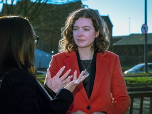 Sarah Coombes MP speaks with a constituent about road safety.