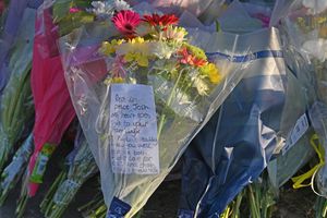 Flowers and balloons have been left at the scene