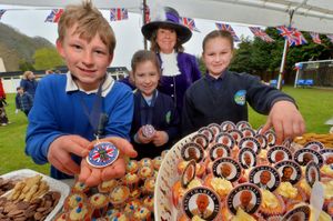 Newcastle CE School, where they and Clunbury CE School and St Marys School Bucknell, had come together for a Coronation party. The High Sheriff : Mandy Thorn was on hand to hand out a medal and party. With her is: Thomas Richards 9, Darcy Perry 8 and Amie Grant 8..
