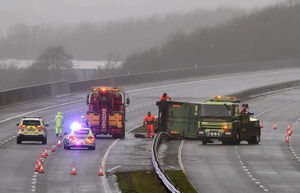 A lorry overturned on the M4 in south Wales, where some of the strongest of Storm Imogen's winds have hit