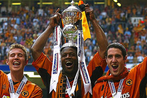 Wolverhampton Wanderers' goal scorers Kenny Miller (L) Nathan Blake (C) and Mark Kennedy (R) celebrates thier victory over Sheffield United in their division one play-off final at the Millennium Stadium in Cardiff, May 26, 2003.