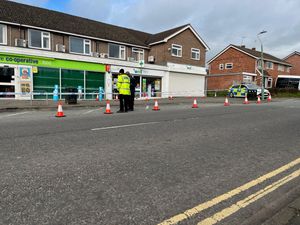 Police have taped off an area outside the shops on Mount Pleasant Road in Shrewsbury.