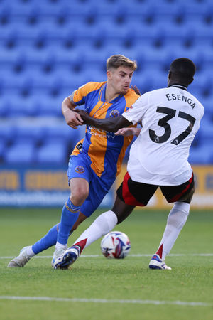 George Lloyd of Shrewsbury Town and Jonathan Esenga of Fulham U21 (AMA)