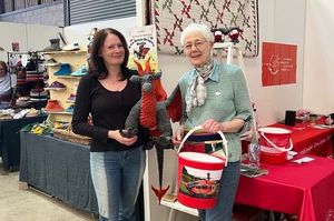 Supporting image for story: Crocheted dragon and hand-crafted memory quilt help to raise more than £5,000 for charity at Wonderwool Wales