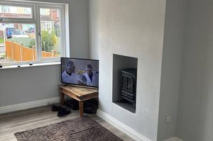 A bright and comfortable living room that flows naturally into the kitchen diner for easy living
