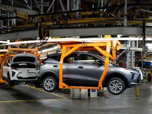 Vehicles move along the assembly line at the General Motors Orion plant (Carlos Osorio/AP)